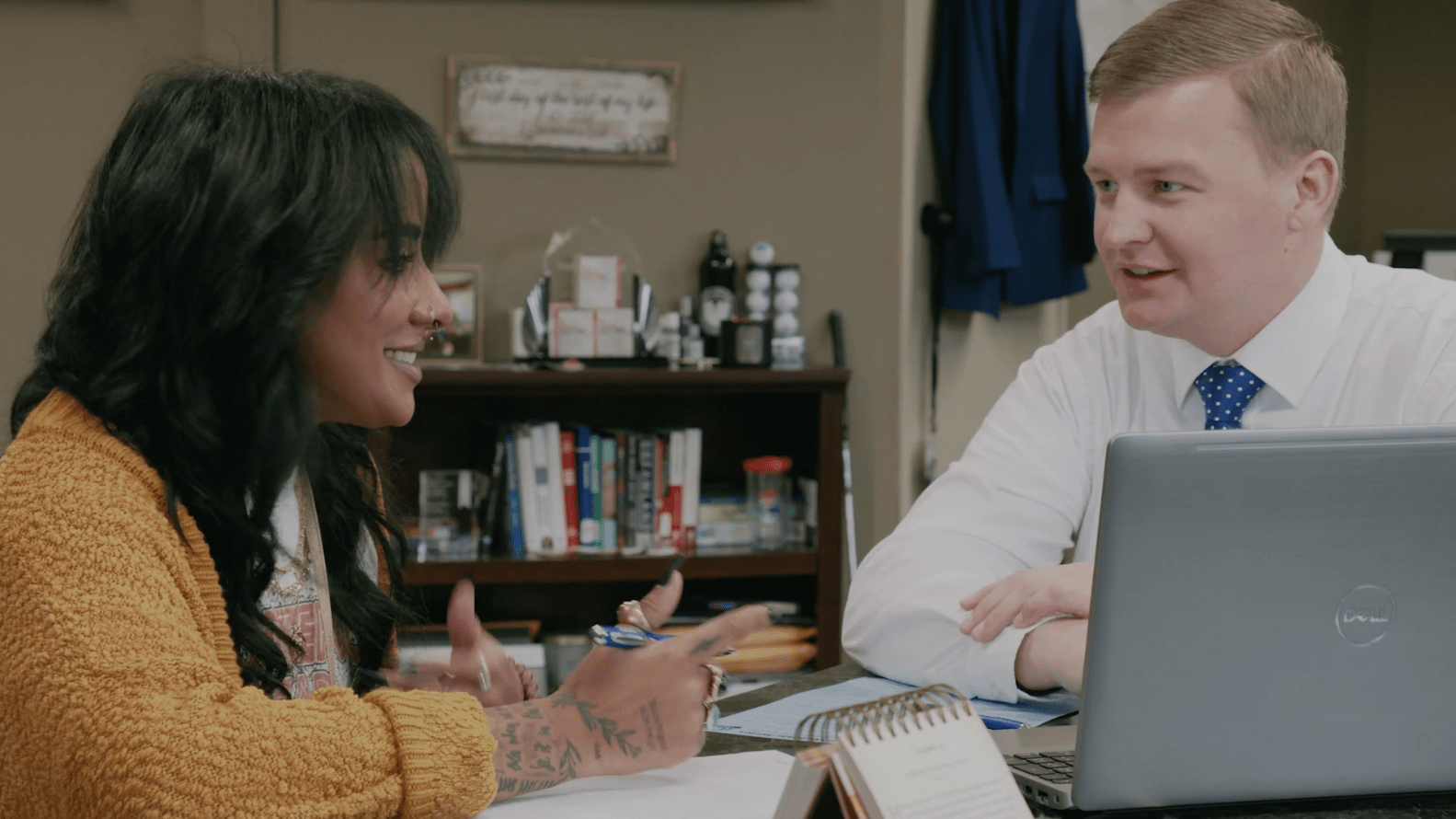 Woman and man working together at a desk in an office